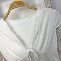Pure and alluring white lace-trimmed cropped top